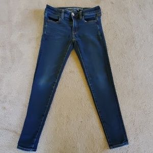Like new American Eagle dark blue skinny jeggins.